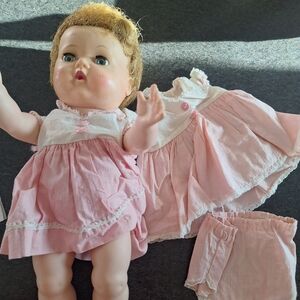 Vintage tinny tears doll with 1 extra outfit.